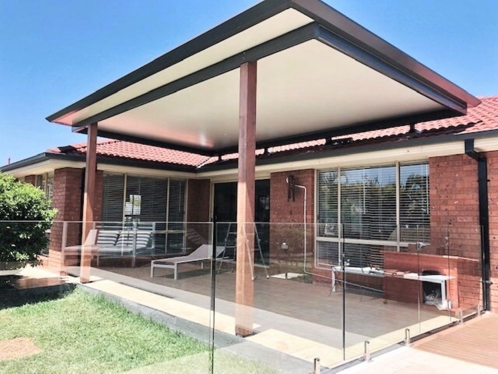 A House With a Covered Porch and a Glass Railing — Outdoor Leisure Living In Tuggerah, NSW