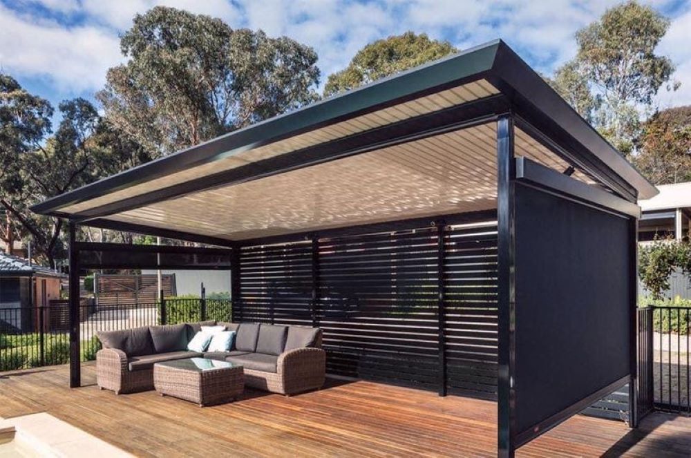 A Patio With a Couch and a Table Under a Pergola — Outdoor Leisure Living In Tuggerah, NSW
