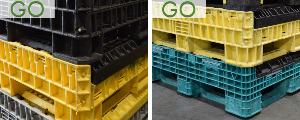 Two plastic pallets are stacked on top of each other.