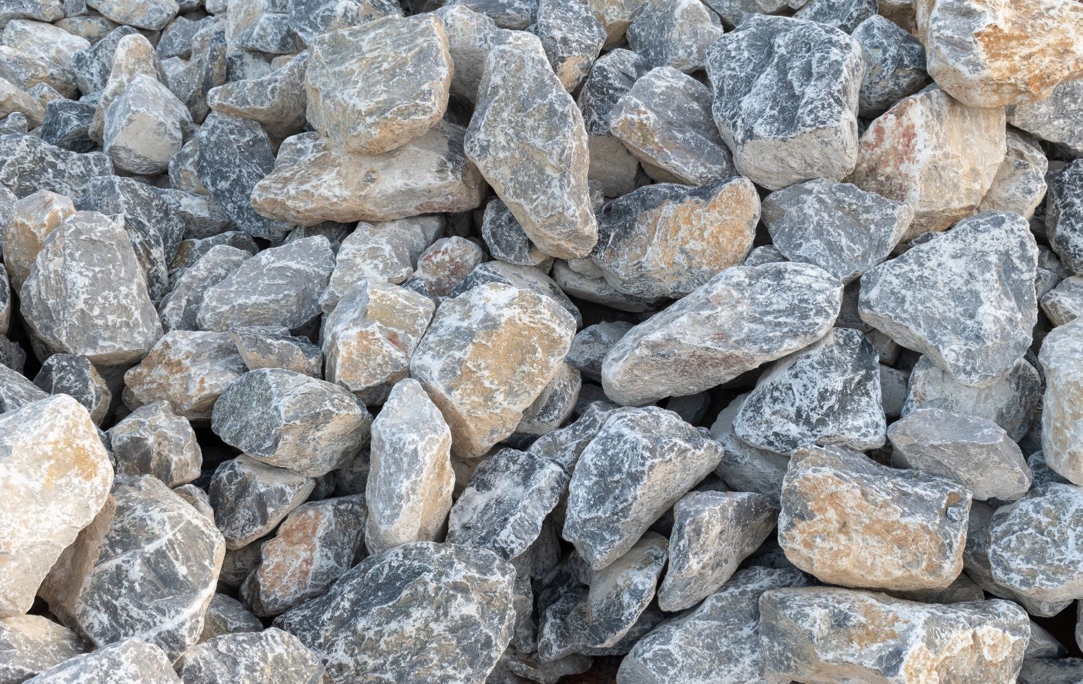 Pile of gray and beige rocks.