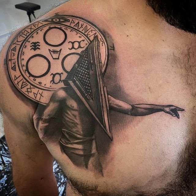 chest and shoulder tattoo