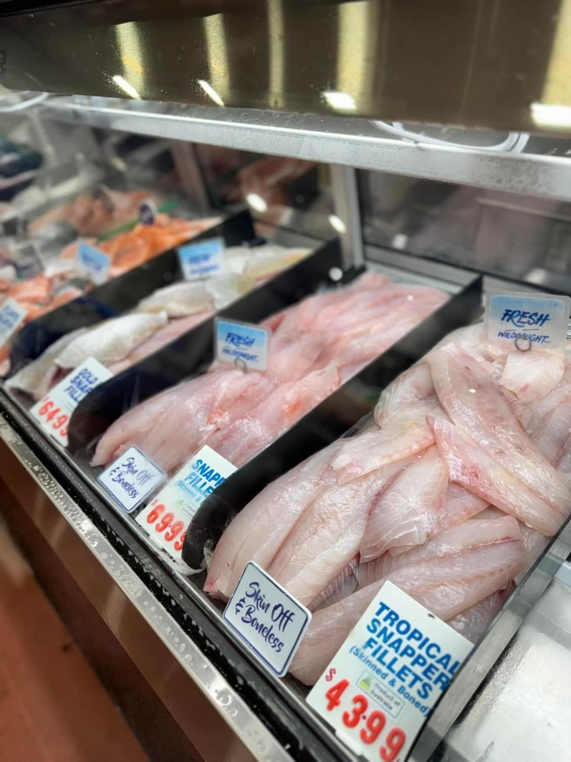 A Display Case Filled With Tropical Snapper Fillets In A Seafood Store — Northern Rivers Seafood In Ballina, NSW