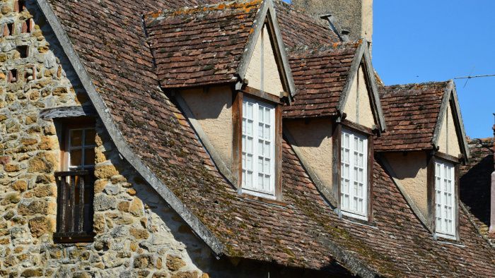 A row of houses with tiled roofs and windows on a sunny day. In Sunderland, UK.