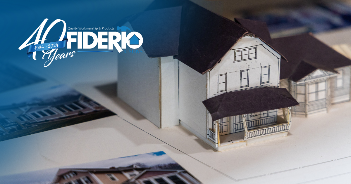 A cardboard architectural model of a house sitting on a table next to building photos, with a 40-year Fiderio logo overlay.