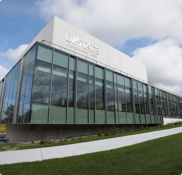 A large building with the word upstate on it