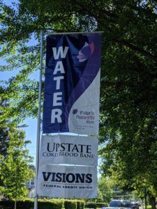 A blue and purple banner that says water on it