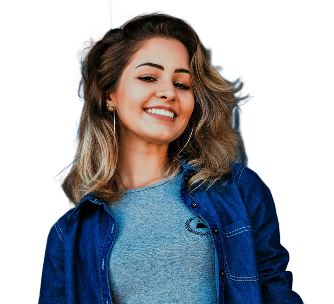 Woman smiling, wearing a denim shirt over a gray top. Leaning against a white background.