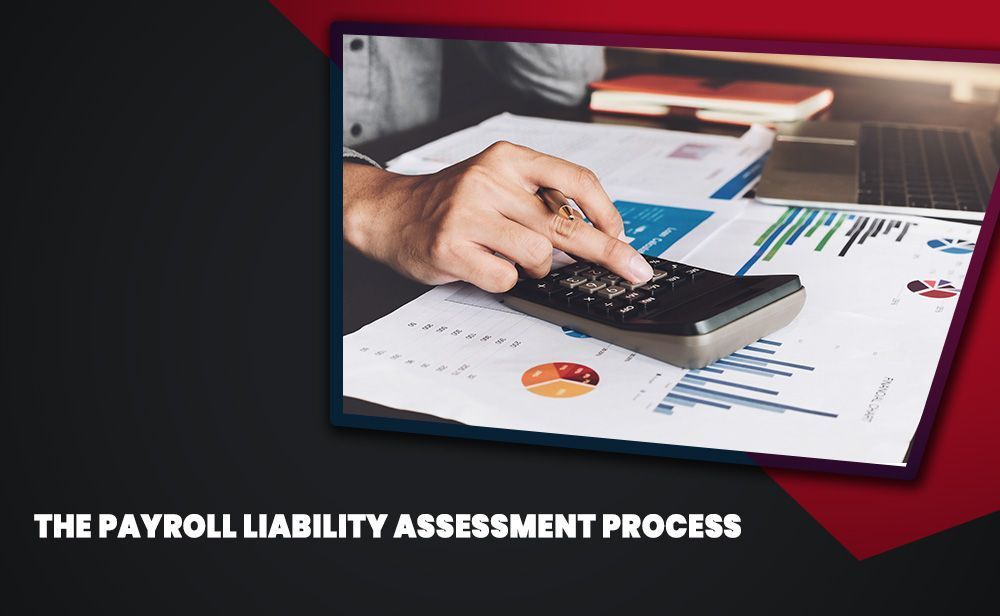 A person is using a calculator to calculate a payroll liability assessment process.