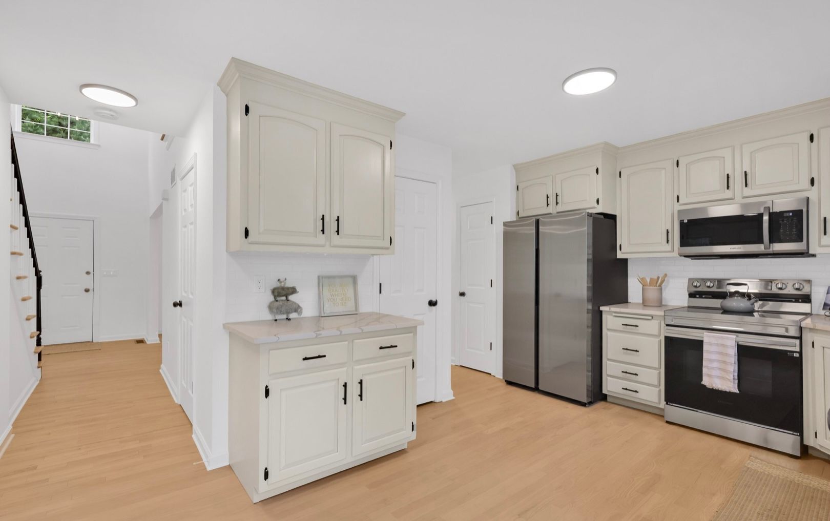 A patio with a lot of furniture and lights at night.