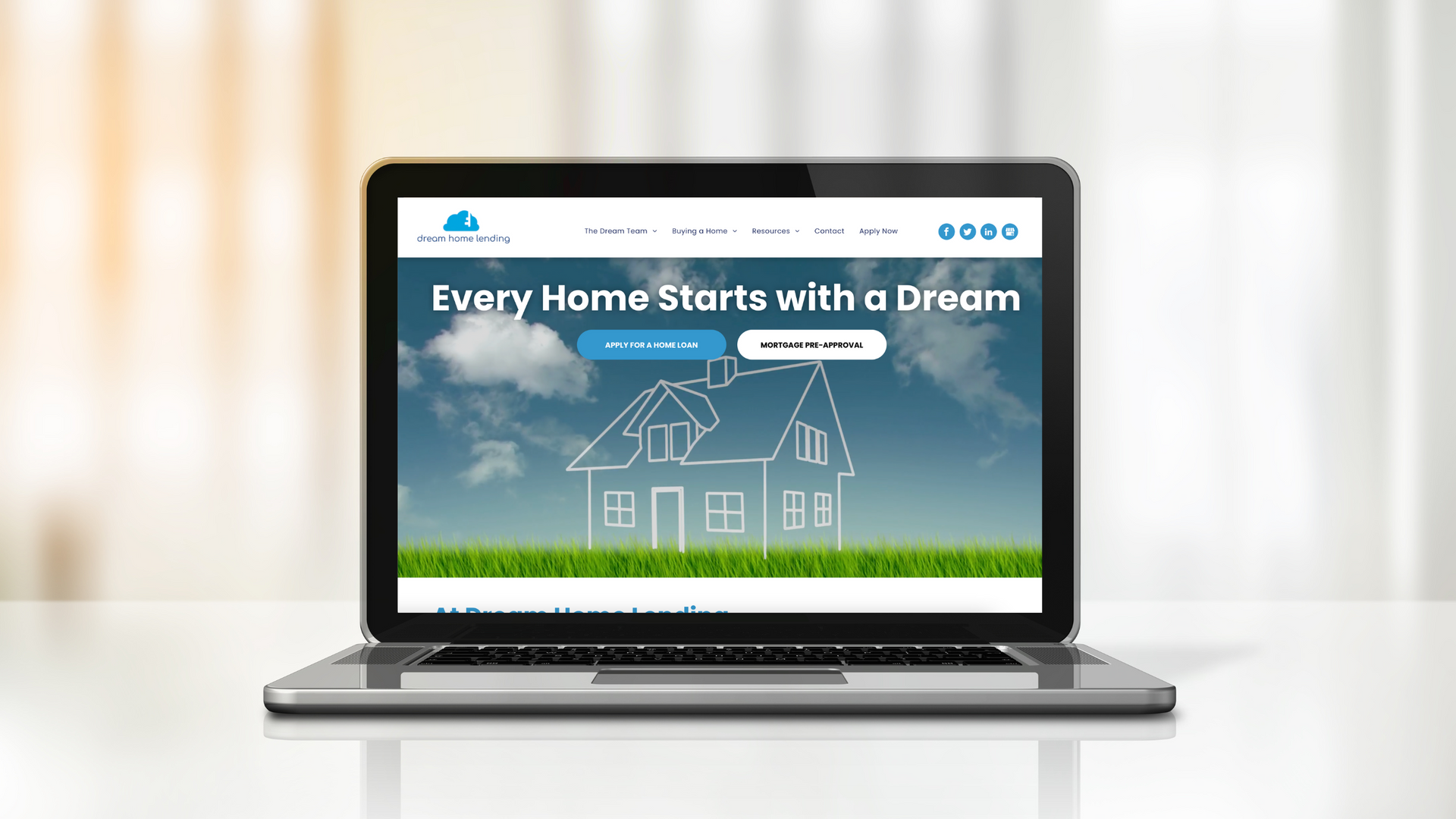 A laptop computer is open to a website that says `` every home starts with a dream ''.