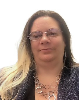 A woman wearing glasses and a necklace looks at the camera