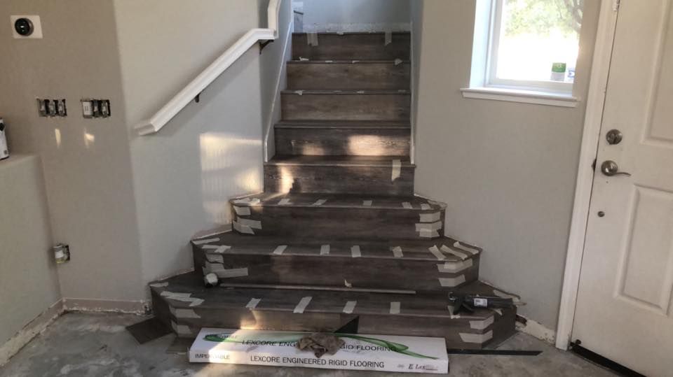 A set of stairs being installed in a house.