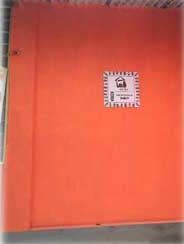 A close up of an orange door with a sticker on it.