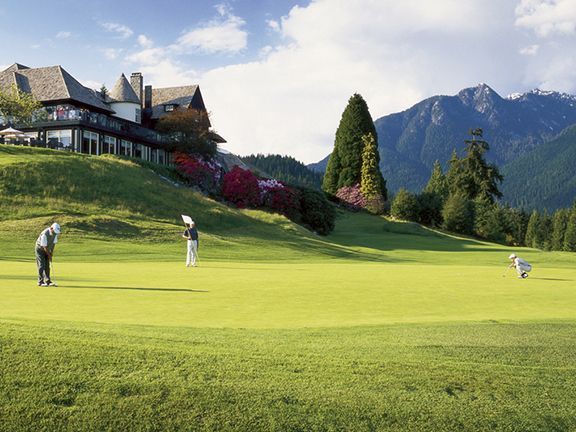 Golfer putts at hole at Capilano Golf and Country Club