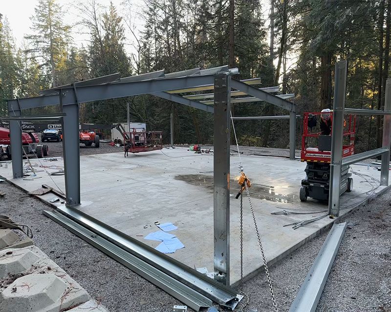 Steel frame gets installed for golf workshop in West Vancouver