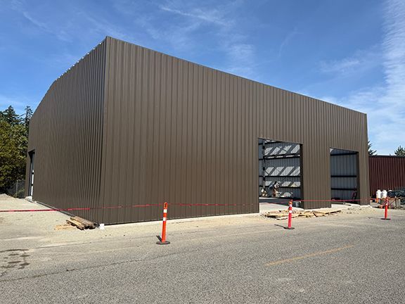 Brown metal building with exterior wall panels 