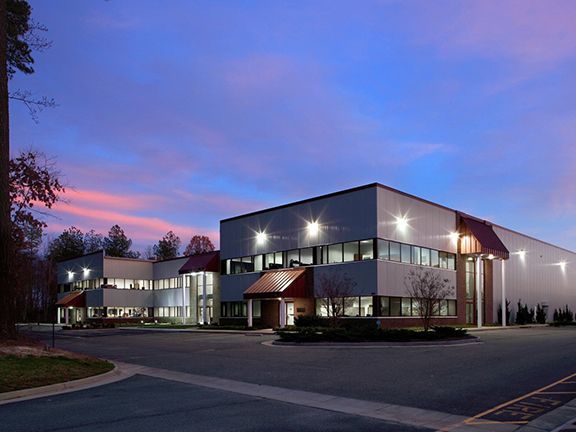 Modern golf clubhouse facility taken at night.
