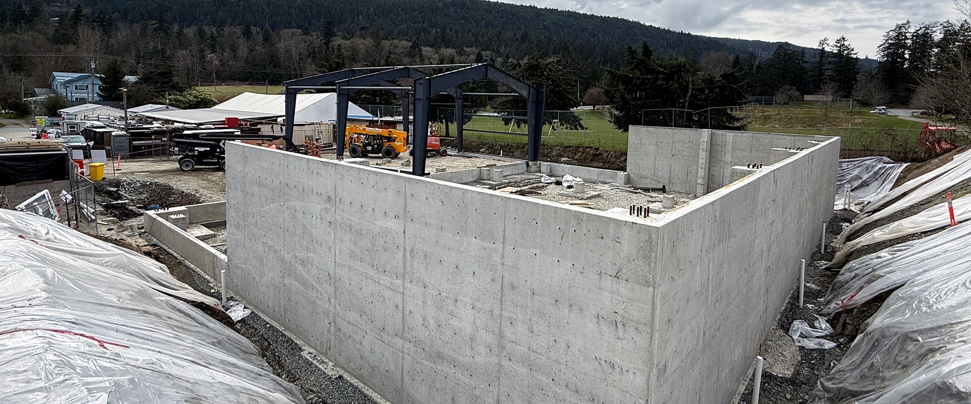 Concrete foundation retaining wall installed on Salt Spring Island construction site.