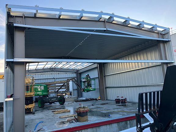 Interior view of metal panels being installed at Vancouver airport jet fuel facility.