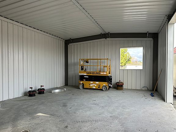 Roofing and metal walls being added at construction project at YVR's jet fuel pump house.