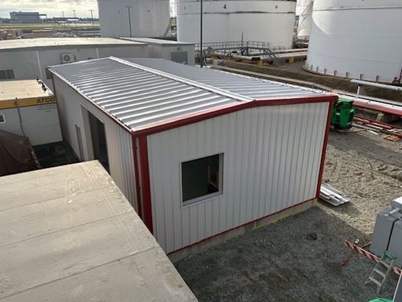 Inside view of completed industrial metal building at Vancouver airport before jet fuel pumps are added.