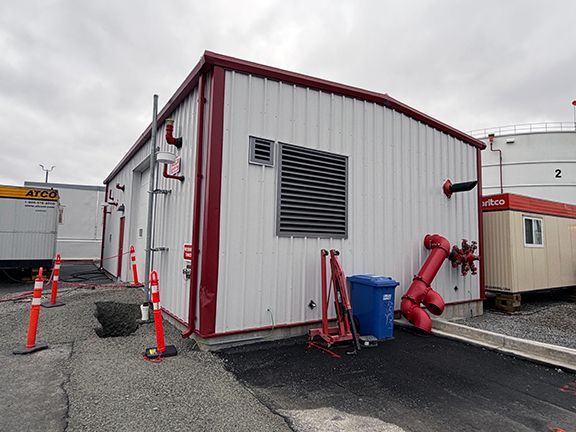 Side view of completed jet fuel pump building at Vancouver Airport