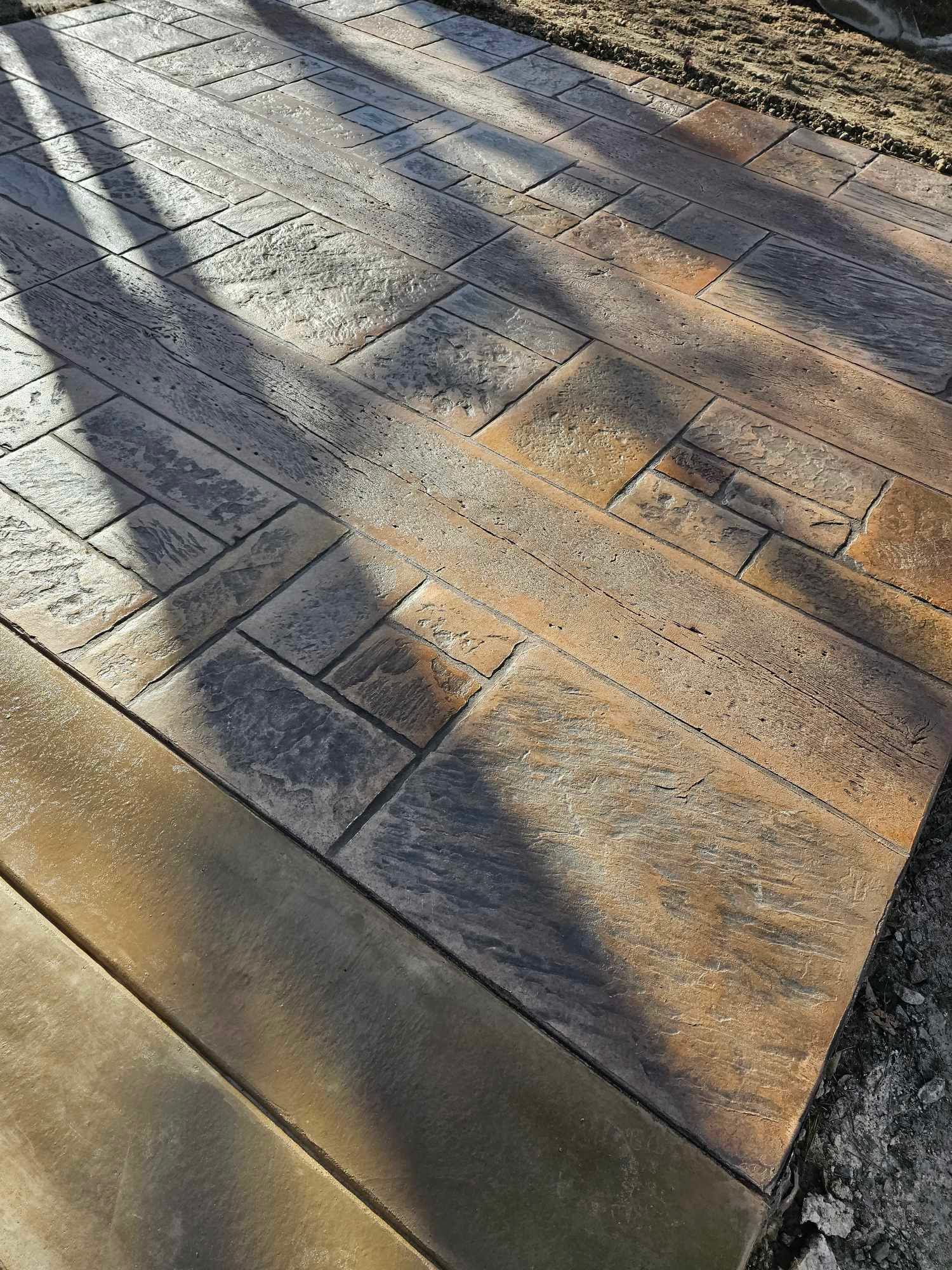 a forklift is driving down a circular driveway in the woods .
