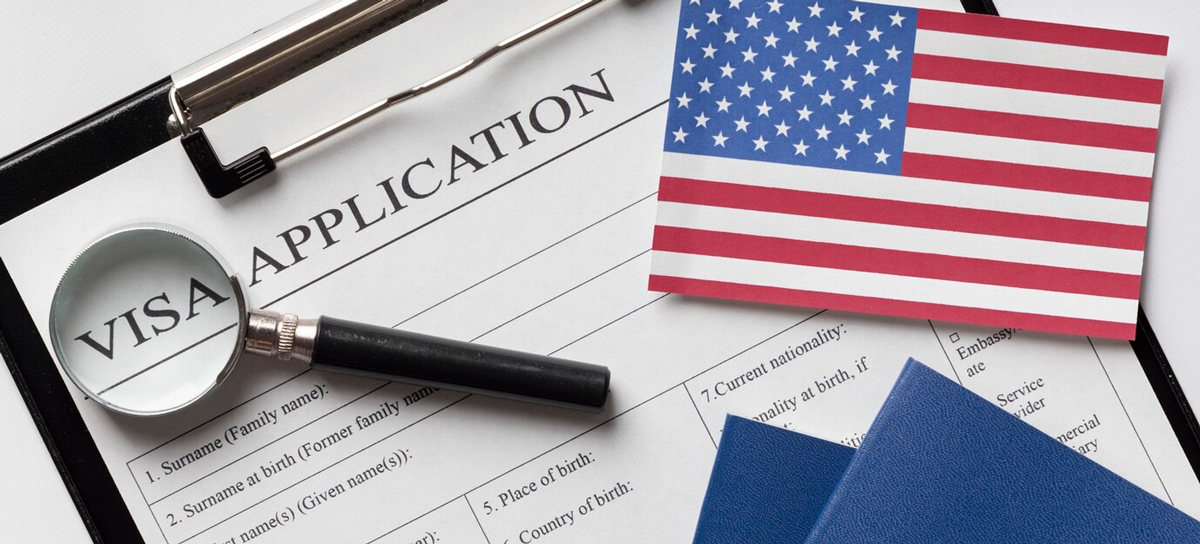 A visa application with a magnifying glass and an american flag