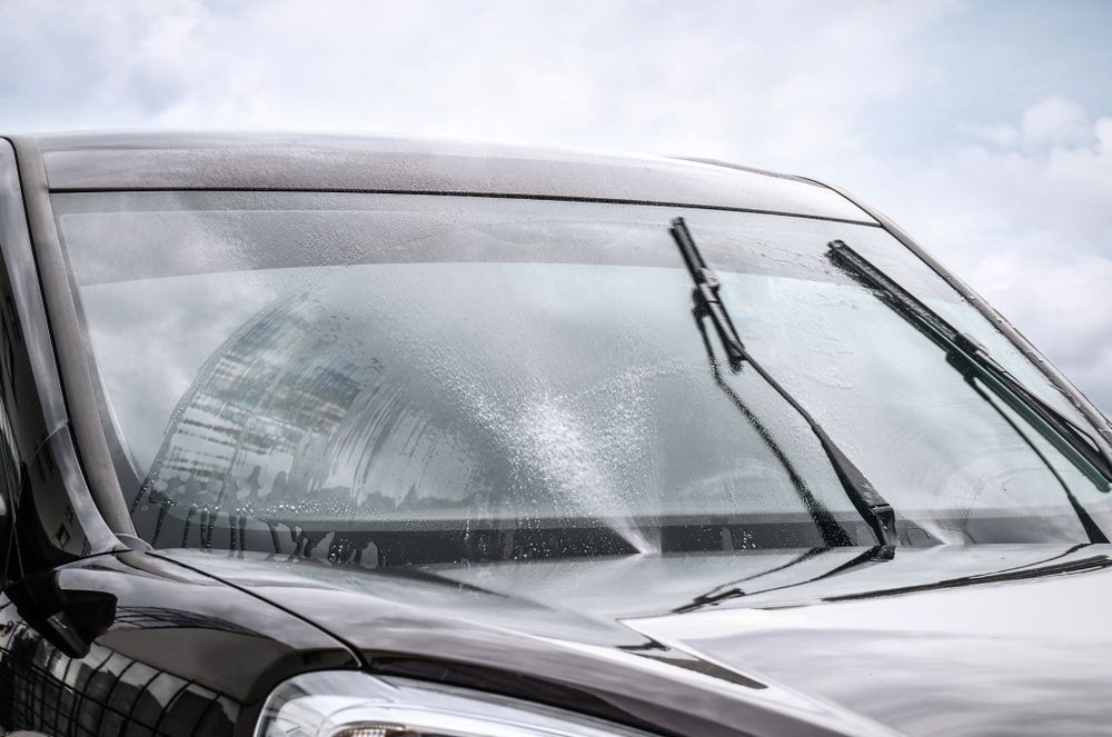 Wipers Cleaning a Car Windscreen — Windscreen Specialist in Dubbo, NSW