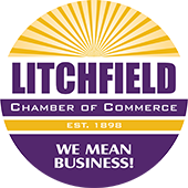 The logo for the litchfield chamber of commerce says `` we mean business ''.
