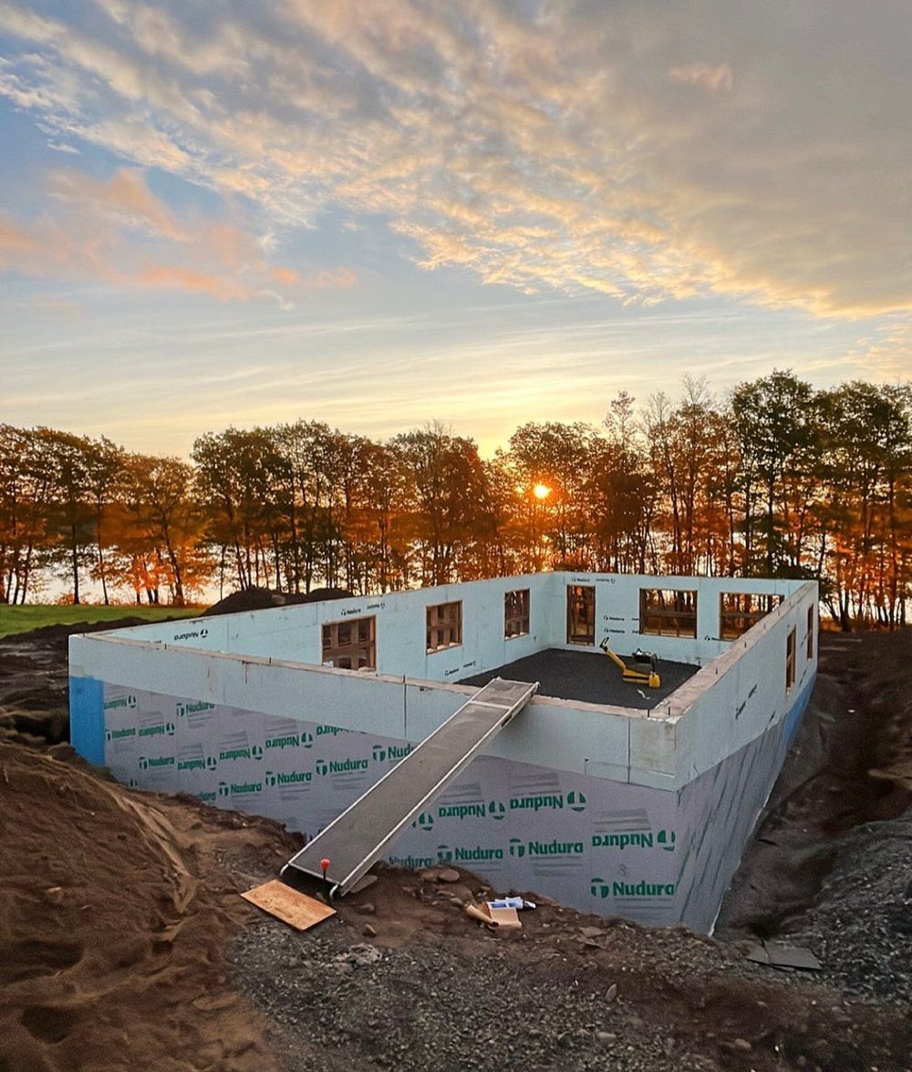 A house is being built in the middle of a forest.