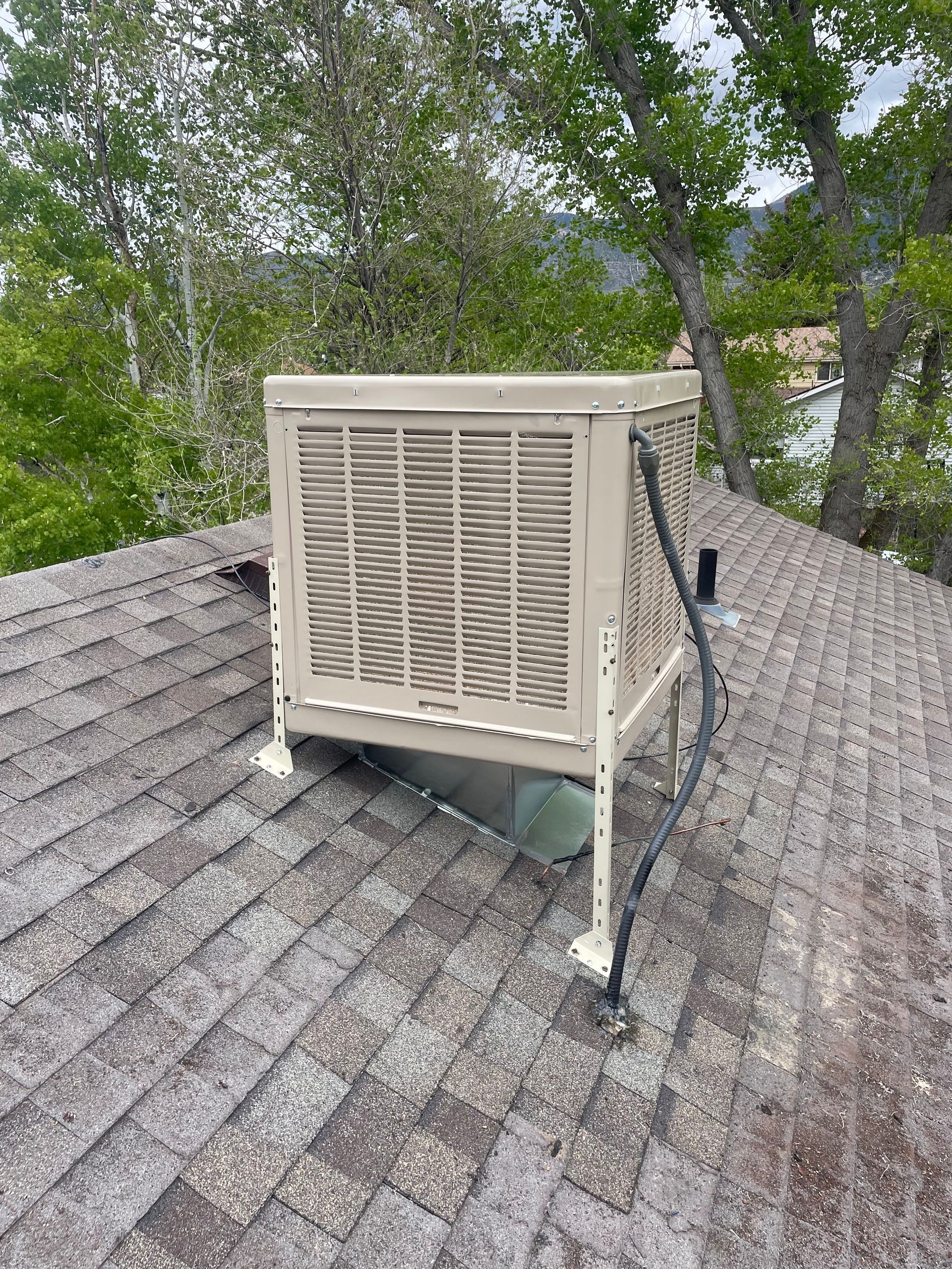An evaporative cooler installation in Parachute, CO with Extra Mile Services