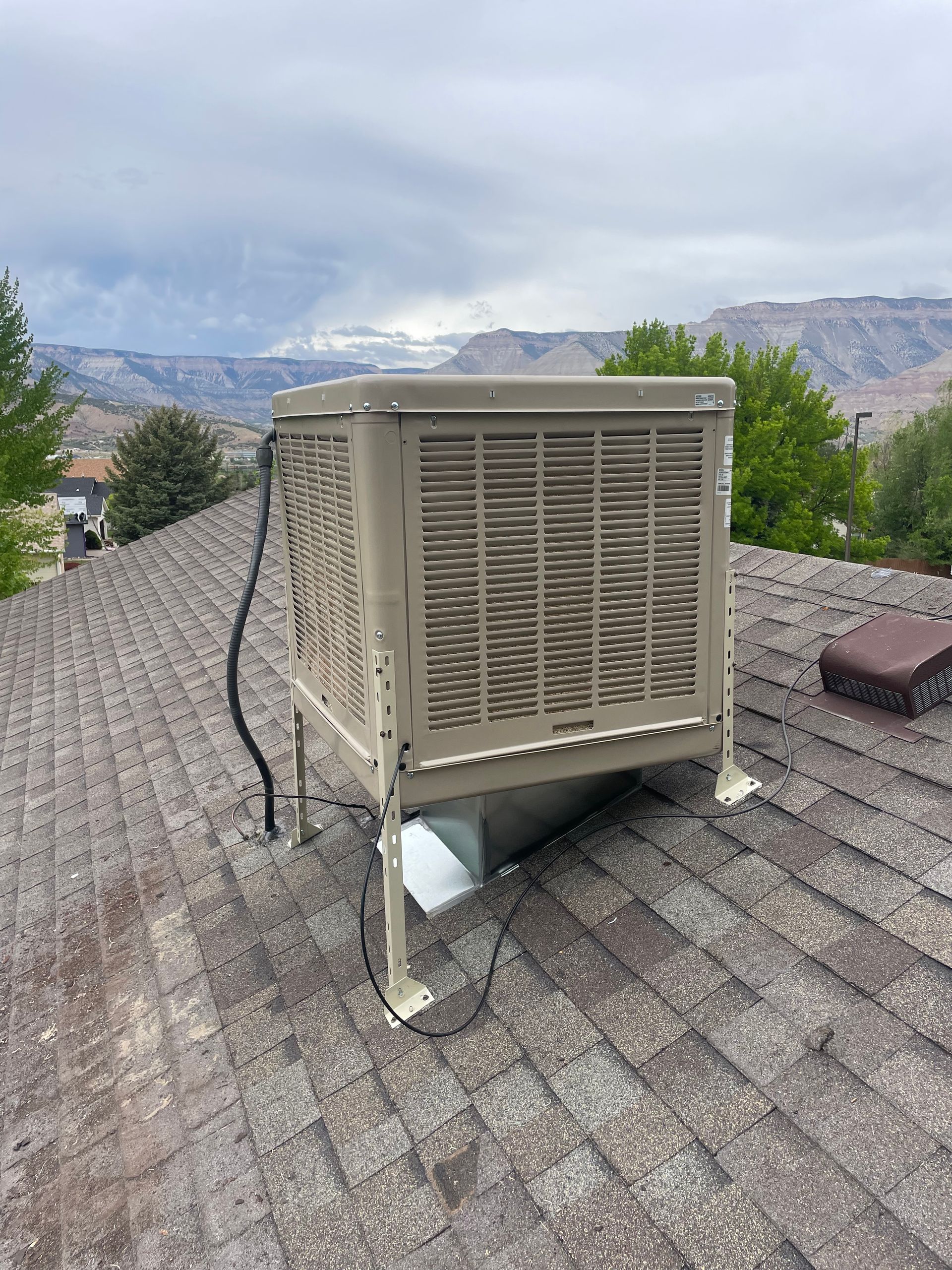 An evaporative cooler installation in Parachute, CO with Extra Mile Services