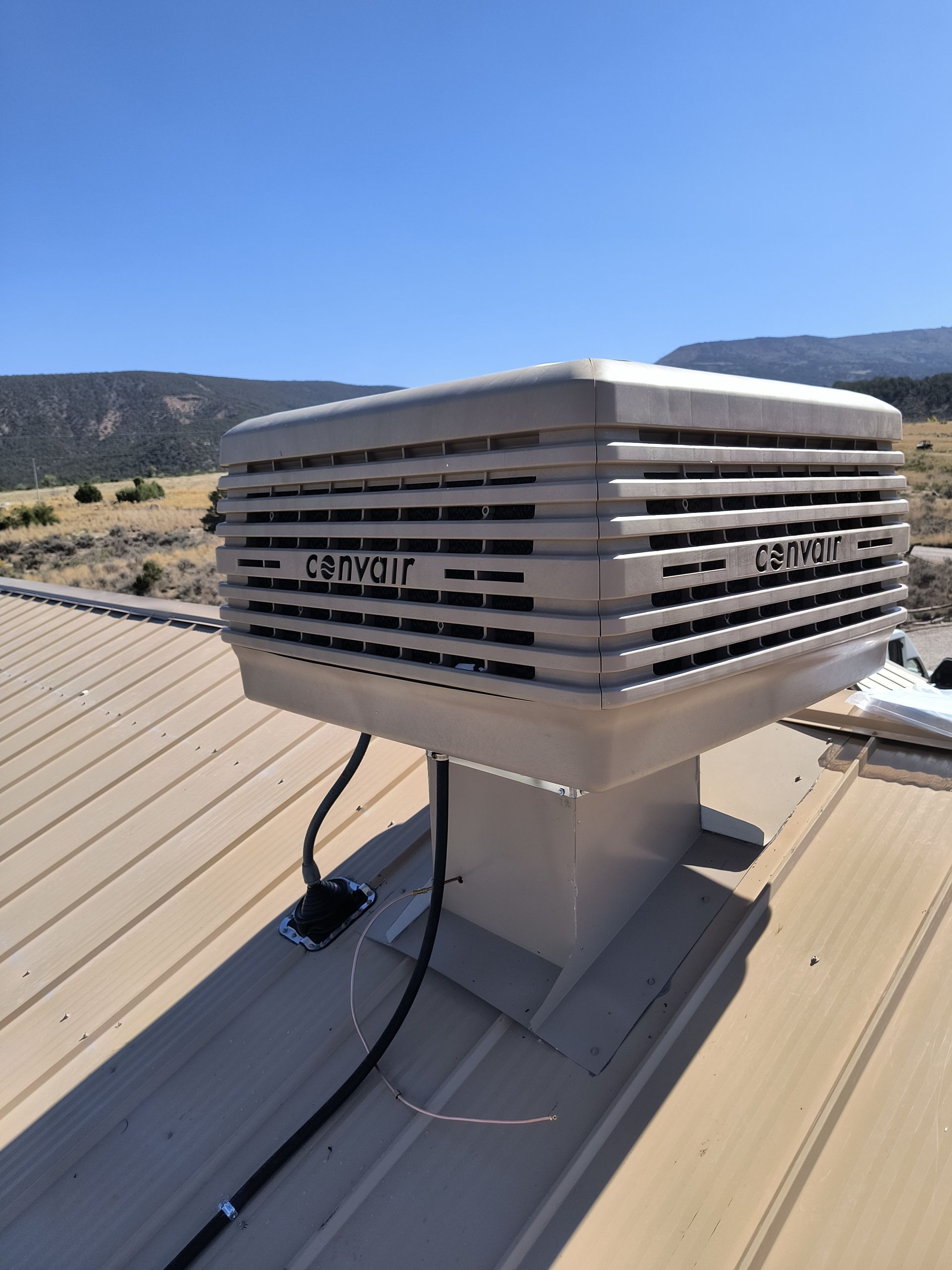 An evaporative cooler replacement in Parachute, CO with Extra Mile Services