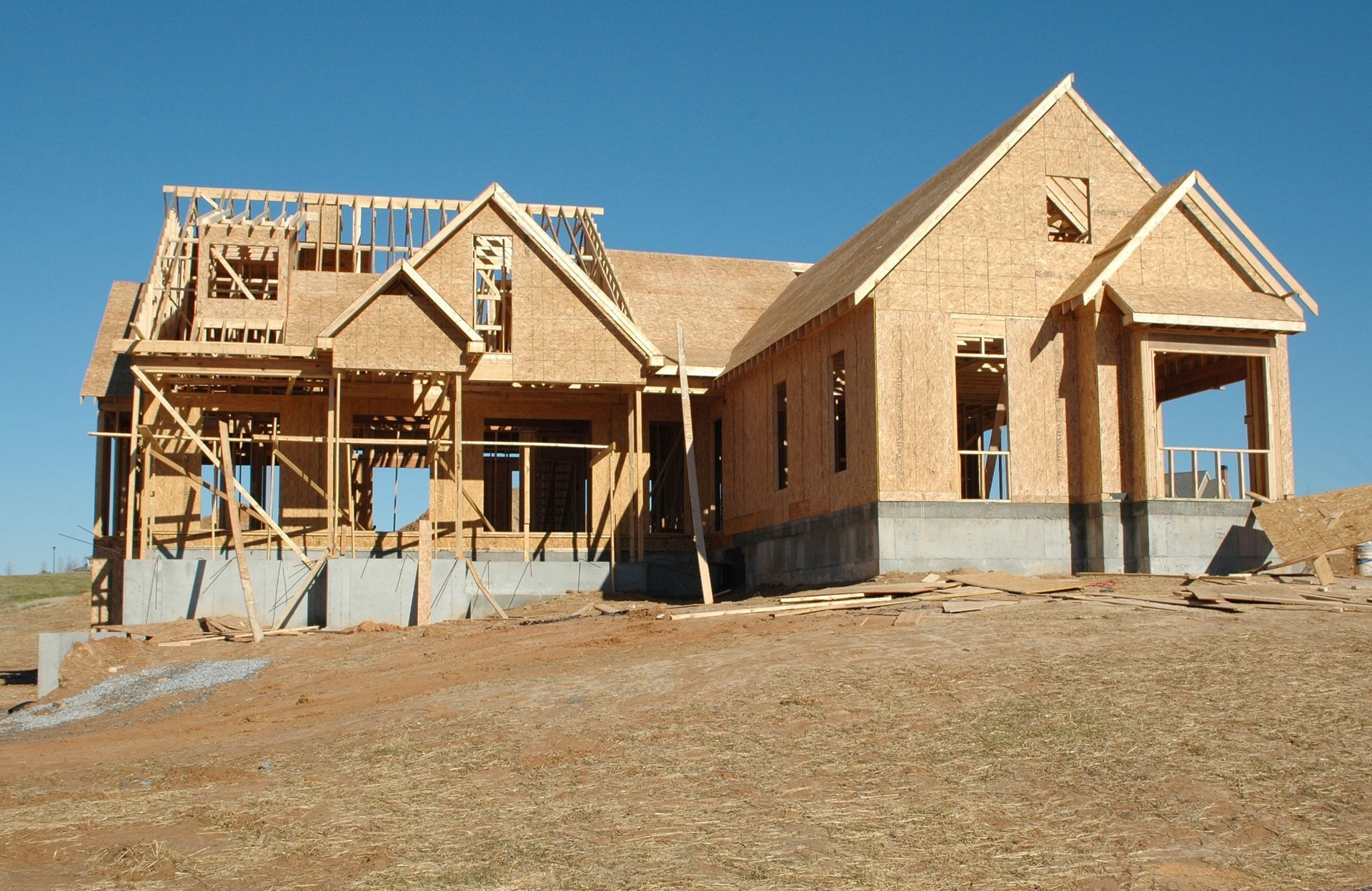 New home under construction with wood framing and plywood sheathing.