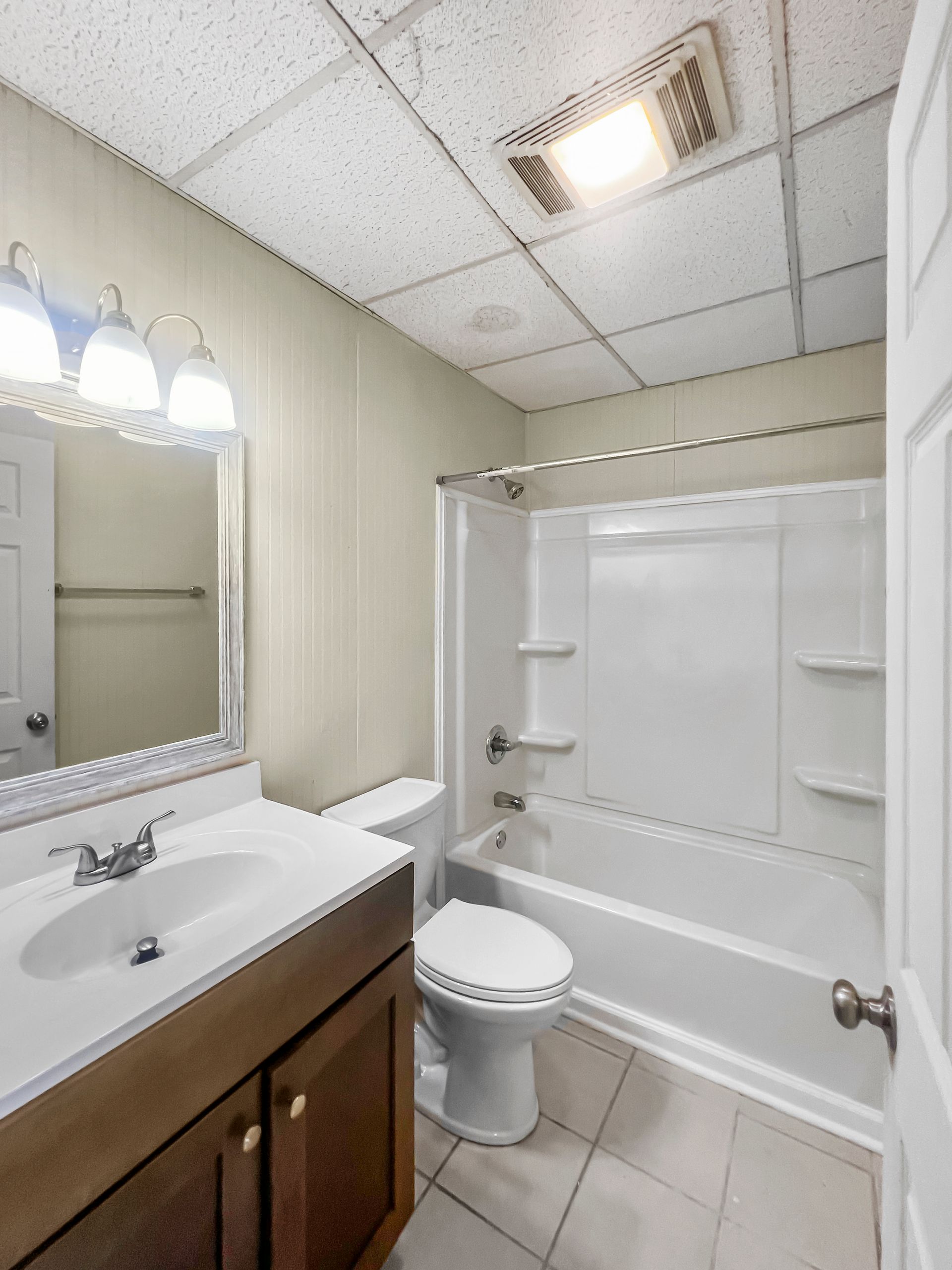 a bathroom with a toilet a sink and a bathtub