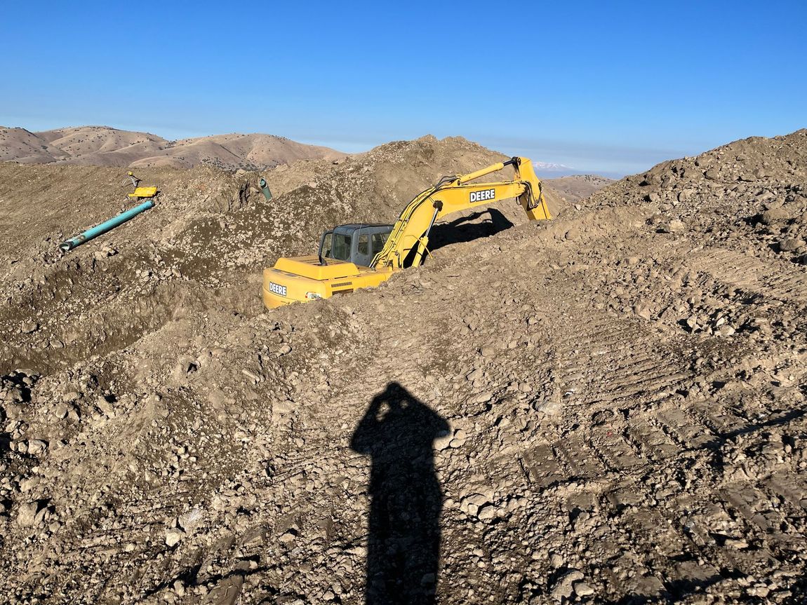 BullRok excavator performing large-scale site grading — commercial project Utah County