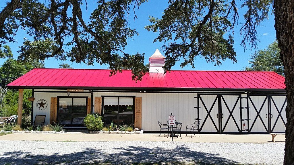 Red Standing Seam Barn Metal Roof by Austin Roofing and Construction 512-629-4949