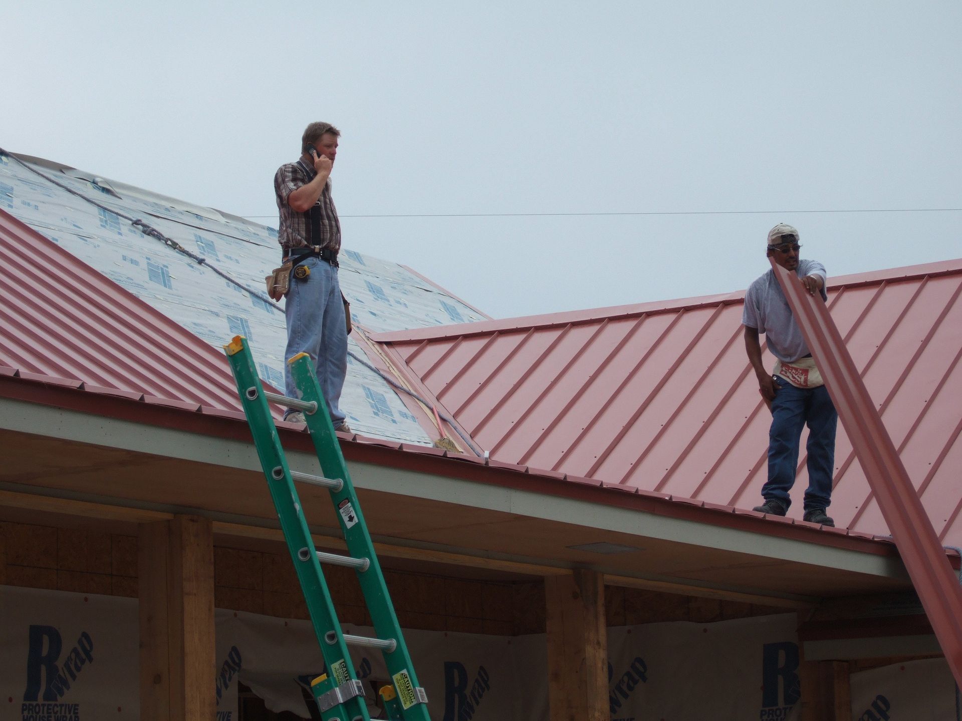 Red Standing Seam Metal Roof  by Austin Roofing and Construction 512-629-4949