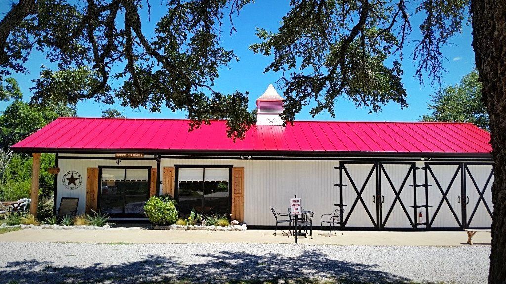 Snap Lock Standing Seam Metal Roof - Color is Deep Red by Austin Roofing and Construction
