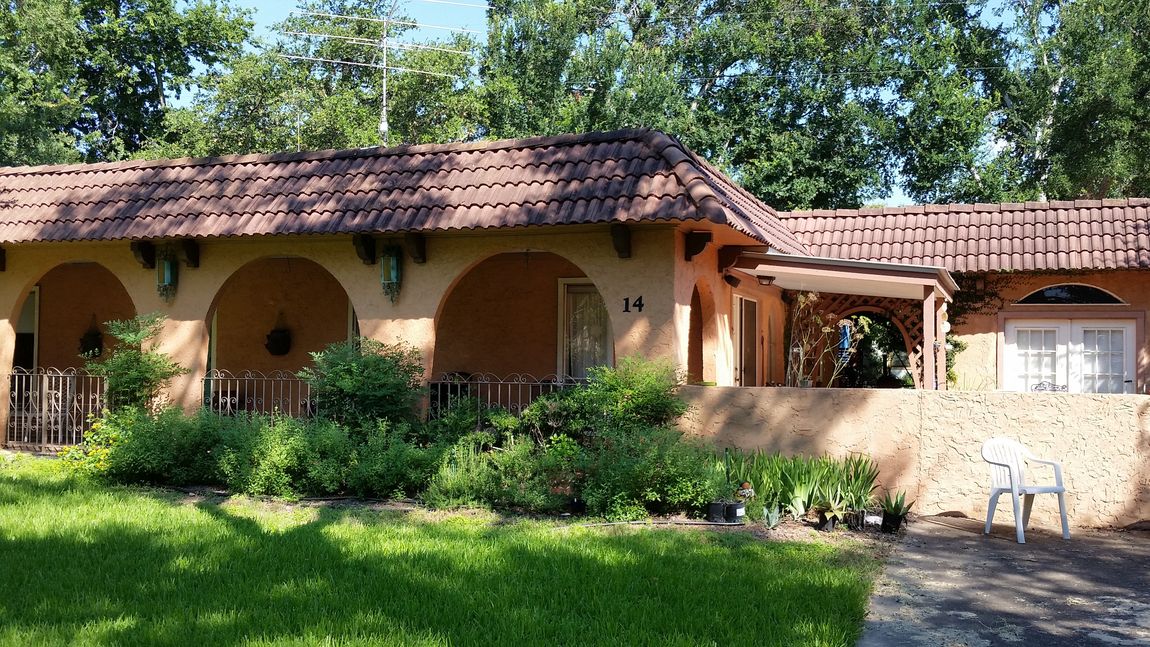 Tile Roof with TPO on Flat - Austin Roofing and Construction