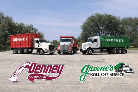 Three trucks with company logos. Two trucks have containers. Red and green containers.