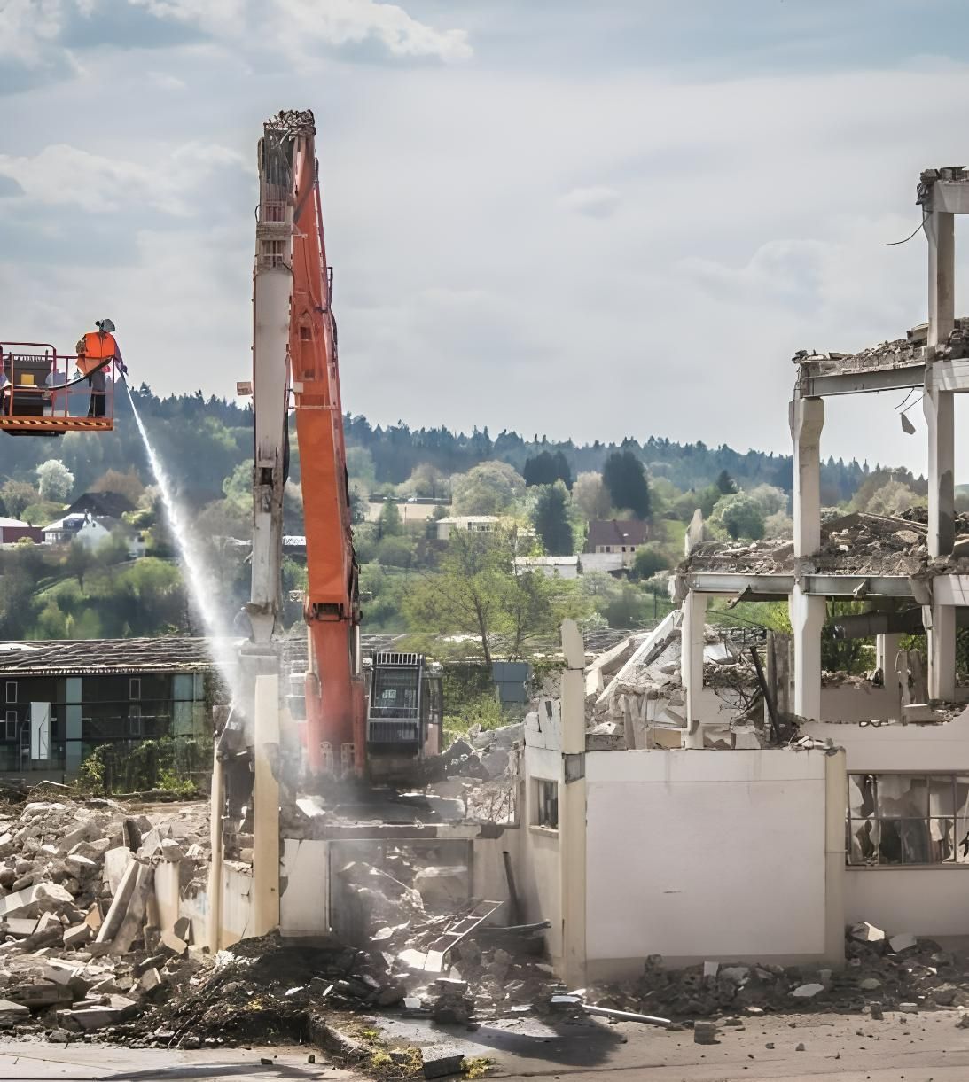 A Large Orange Excavator is Demolishing a Building — Husky Demolition In Heatherbrae, NSW