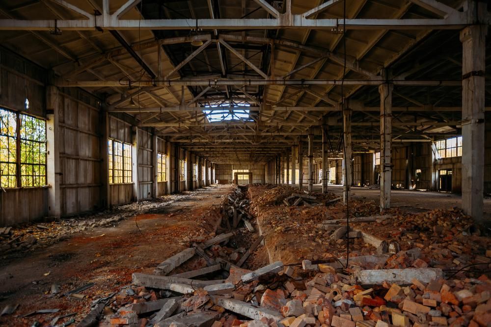 The Inside of an Abandoned Building With a Lot of Bricks on the Floor — Husky Demolition In Mayfield, NSW