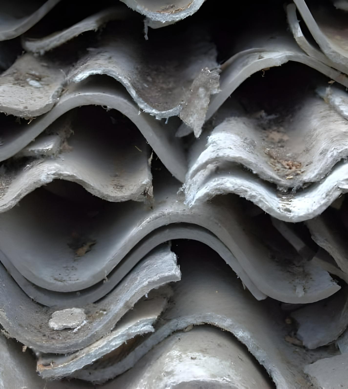 A Pile of Roof Tiles Are Stacked on Top of Each Other — Husky Demolition In Heatherbrae, NSW