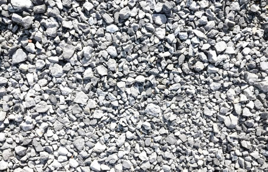 A pile of gravel is sitting on the ground 