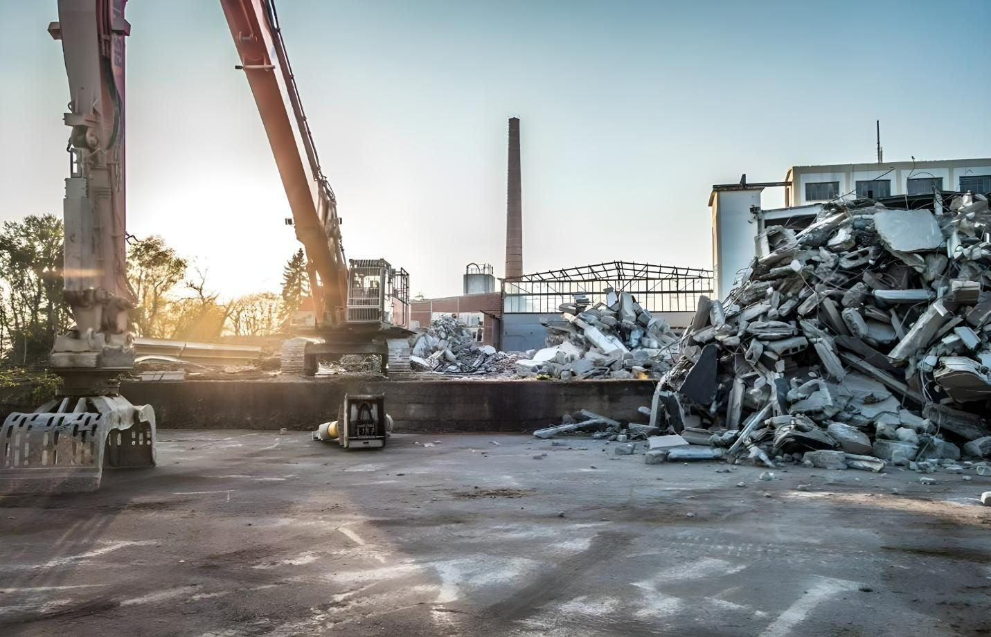A Large Pile of Scrap Metal is Being Loaded Into a Truck — Husky Demolition In Heatherbrae, NSW