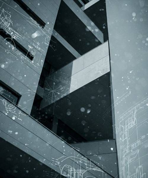 A black and white photo of a building with drawings on it