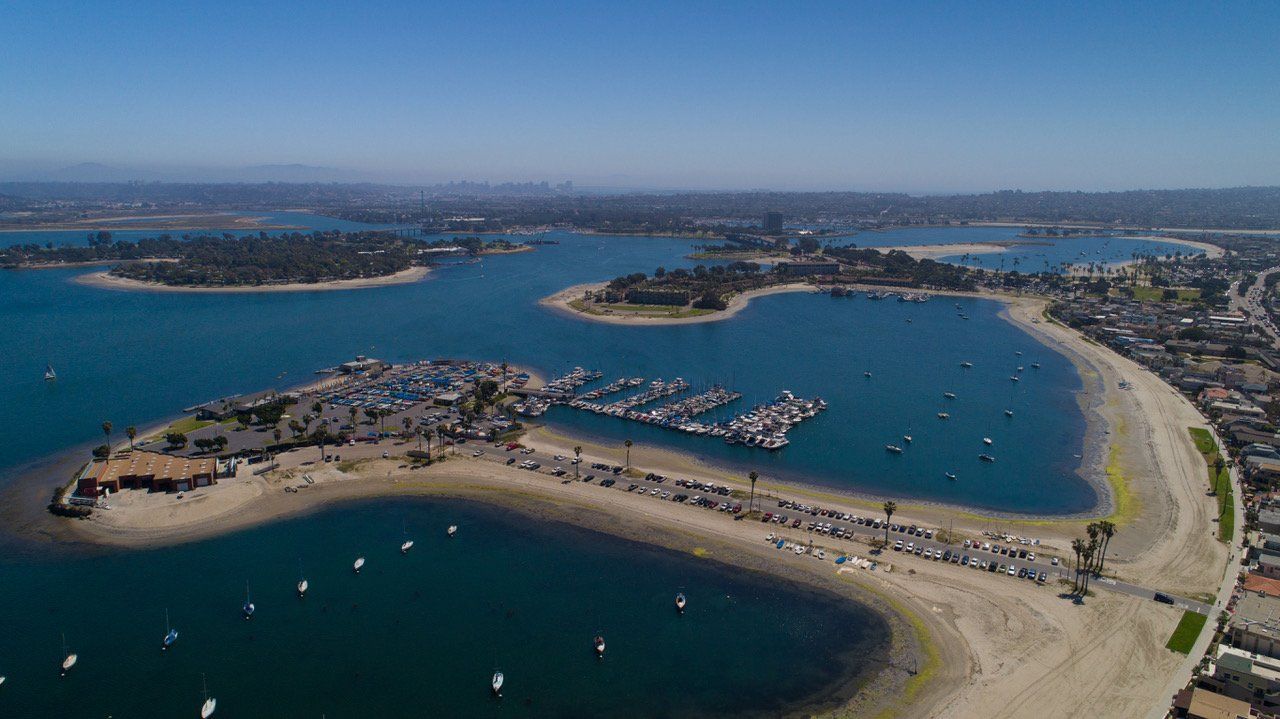 An aerial view of a small island in the middle of a large body of water.