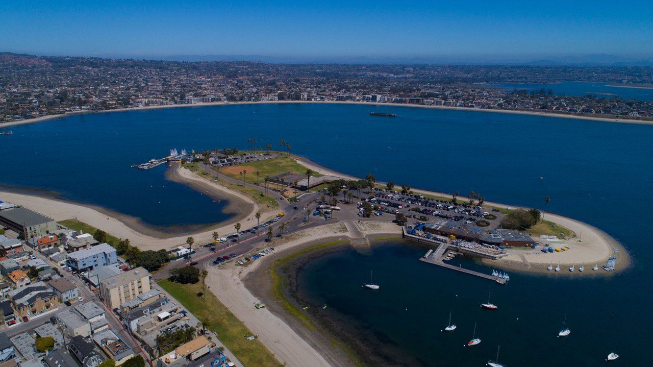 An aerial view of a small island in the middle of a large body of water.